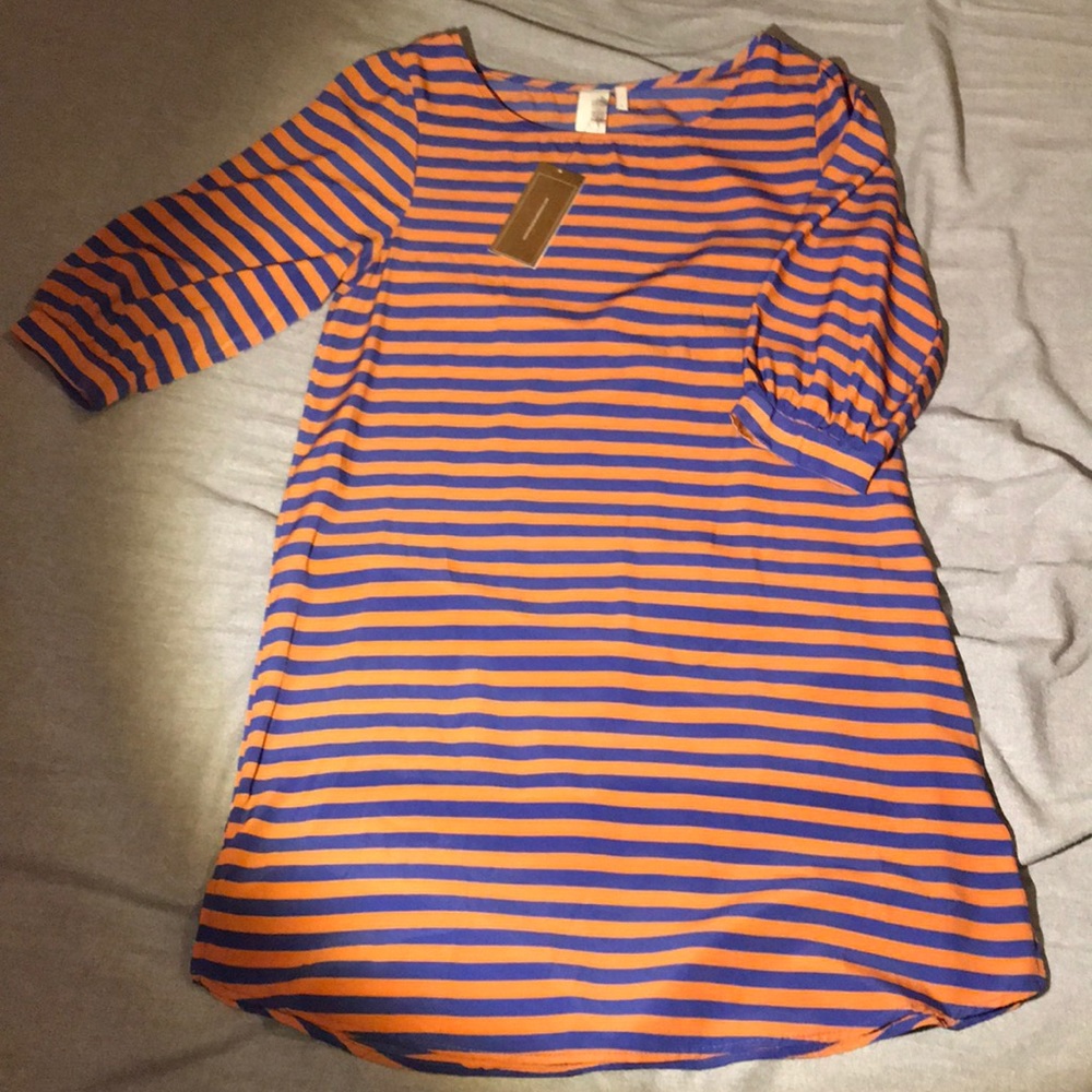 Francesca’s orange and blue striped dress.